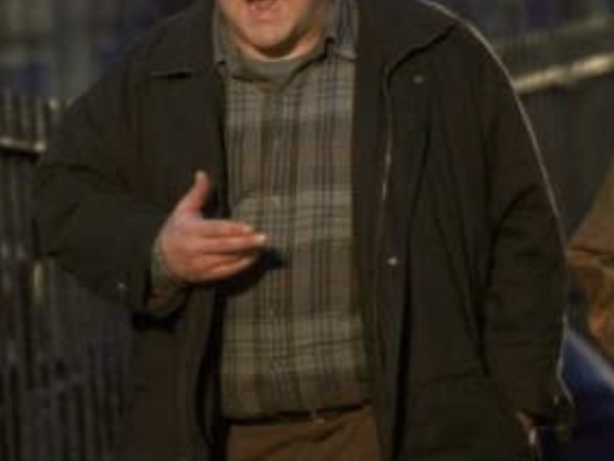 john goodman wearing broken up plaid shirt